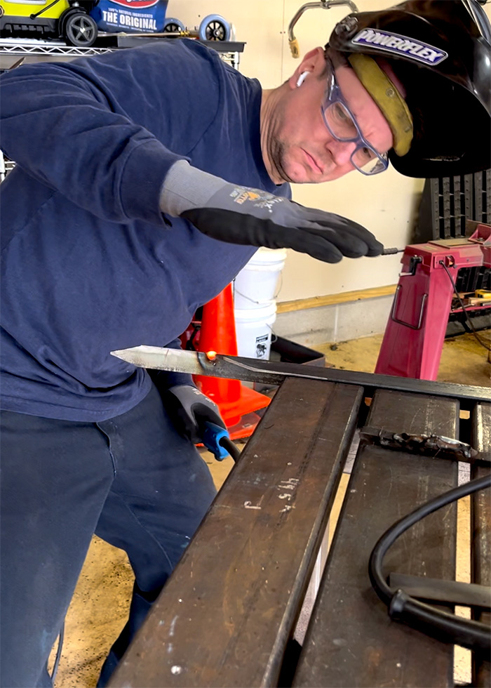 Nate working on a steel bar